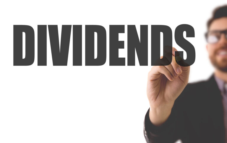 23 05 14 a person writing the word dividends mf dload