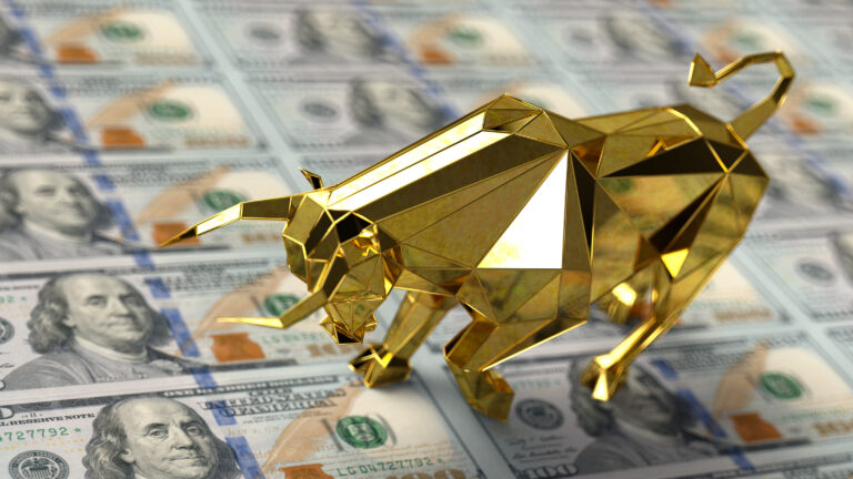 a golden bull on hundred dollar bills