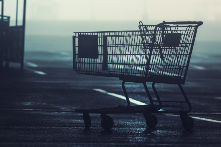 empty shopping cart in a parking lot