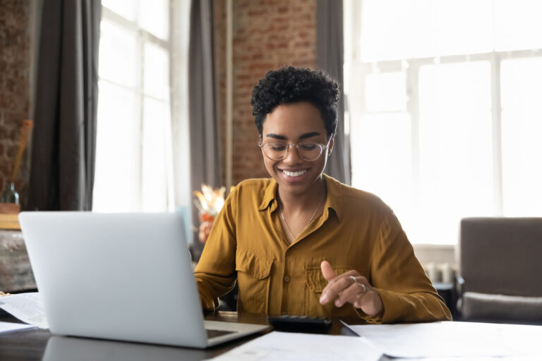 investor smiling computer 1200x800 5b2df79