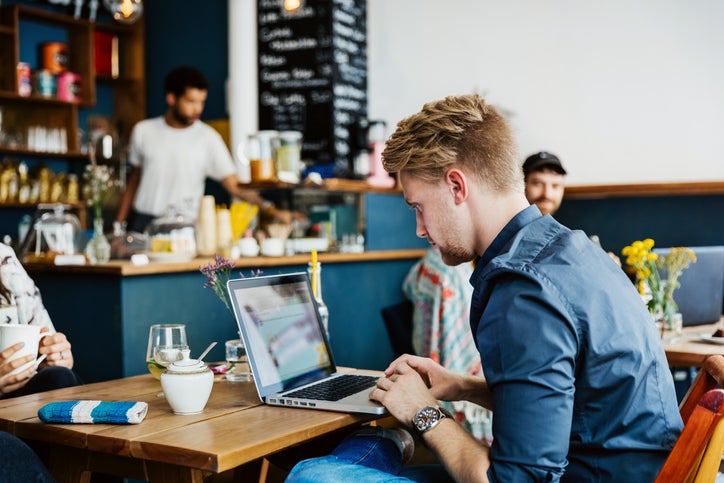 man on laptop in cafe A4hC75u