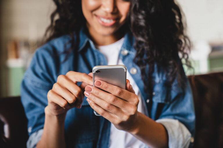 person on their phone looking at stock prices