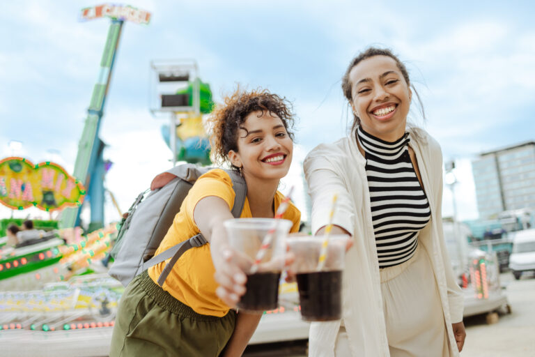 smiling friends with soft drink cups 1630177922 2