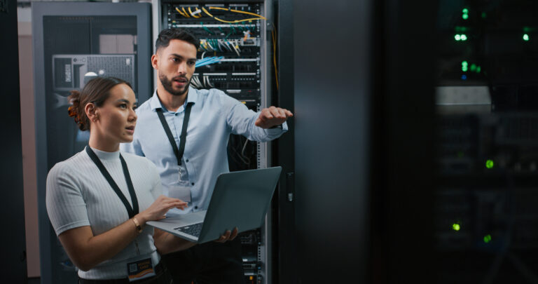 cloud computing it technicians in a server room gettyimages 1332104905