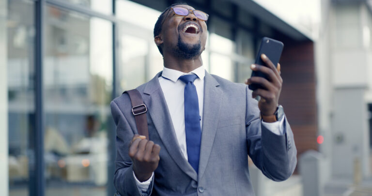 happy investor celebrating stock win