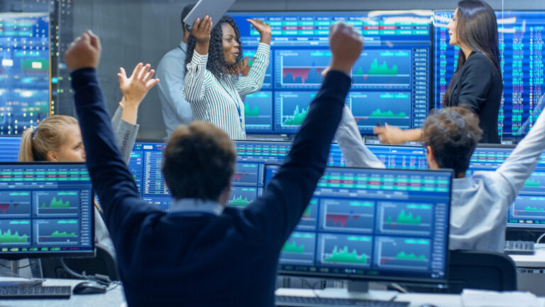 happy traders wall street celebrating profit growth win