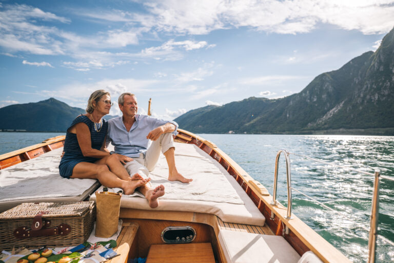 vacation older couple travel boat mountains