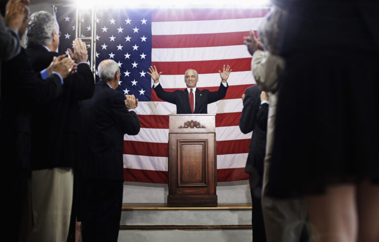 a politician making a speech at a podium