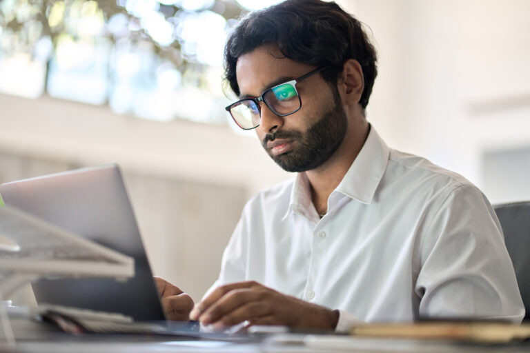 analyst working on a laptop