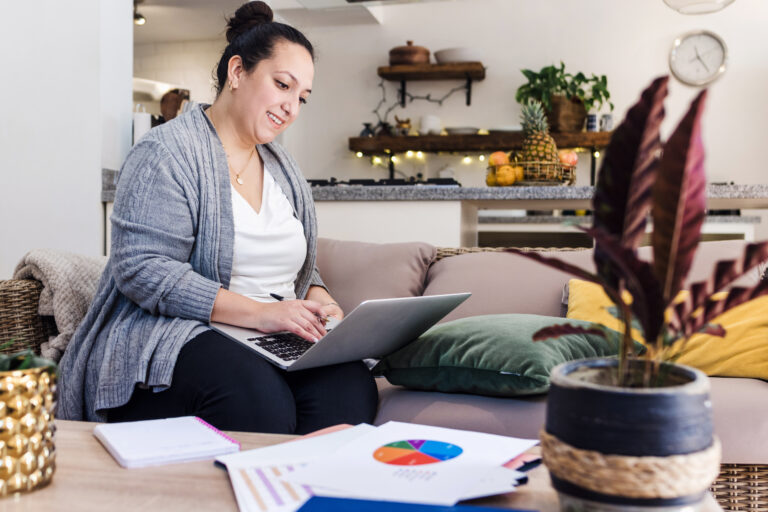 businesswoman working on laptop at home