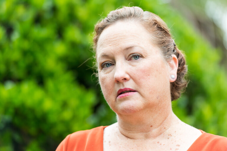 getty person looking concerned thoughtful worried green background