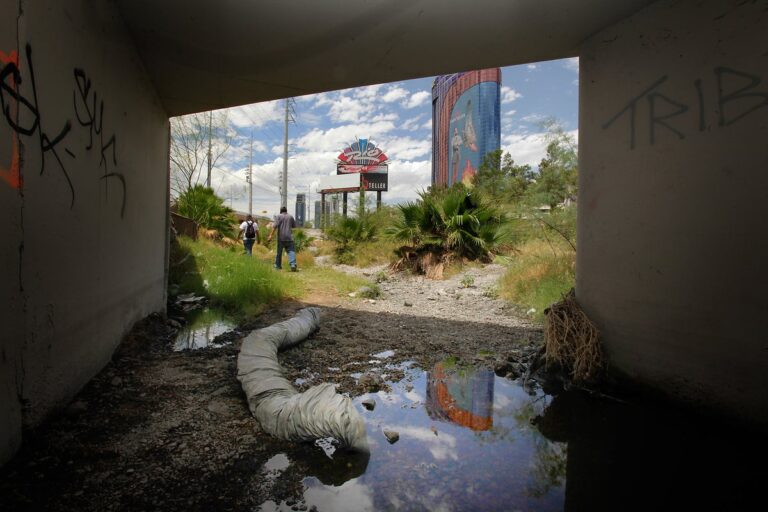 houseless men walk out of las vegas flood control tunnel