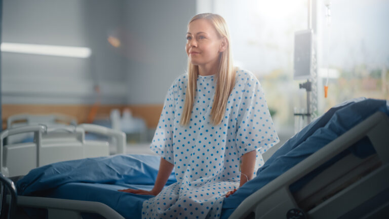 patient sitting on hospital bed