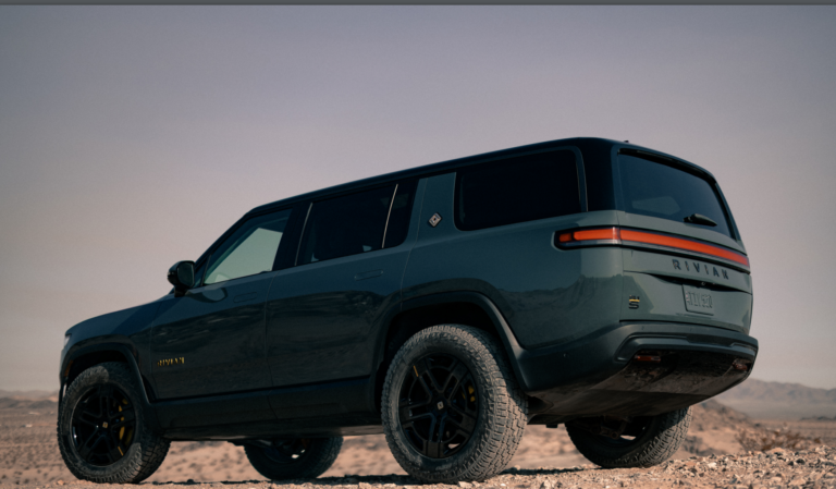 rivian r1s suv parked off road