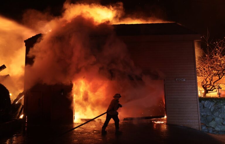 Firefighter battles fire