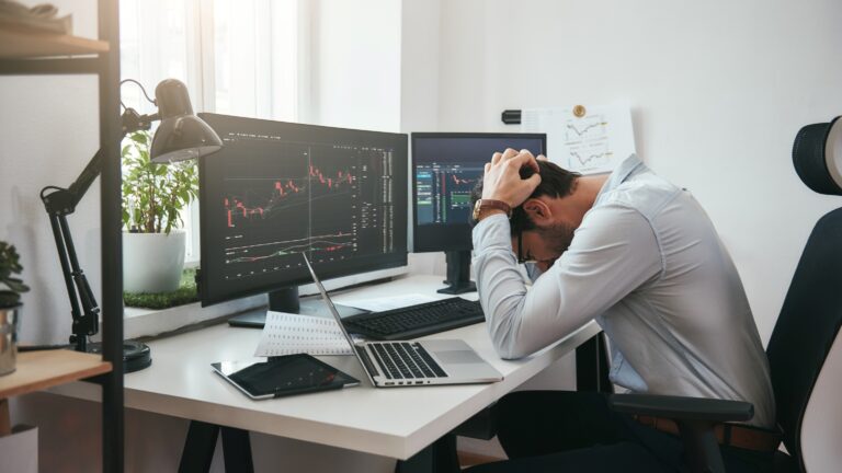 frustrated investor looking at stocks