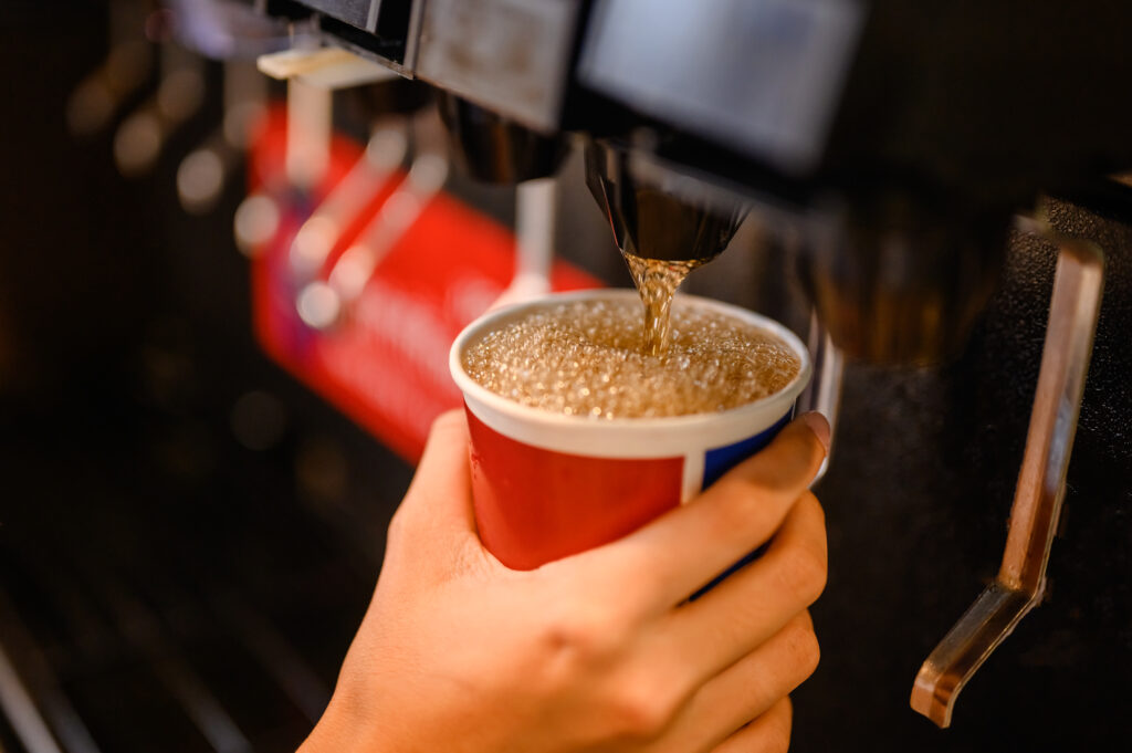 a fountain soft drink being poured