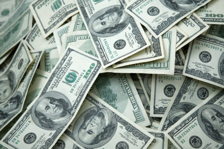 a loose collection of 100 dollar bills