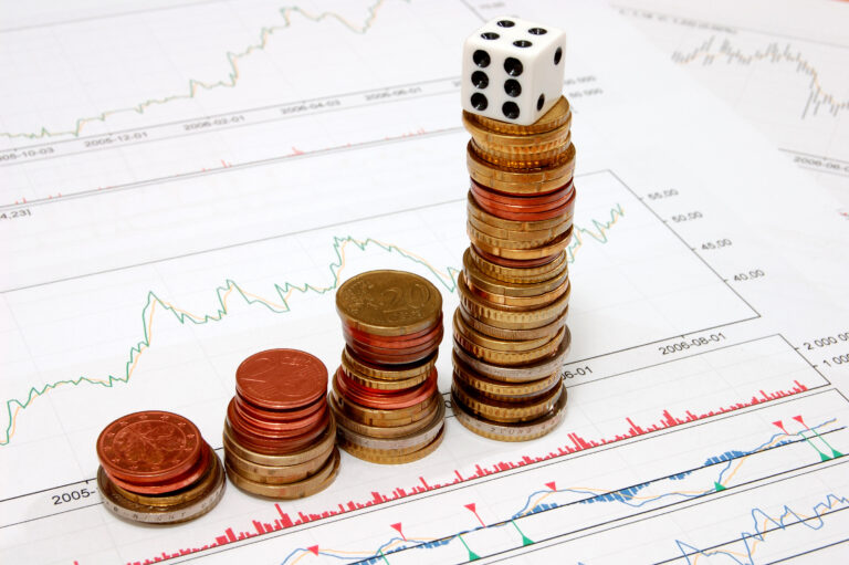 stock chart coins and gambling dice