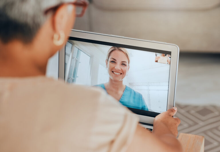 two people participating in a telehealth session